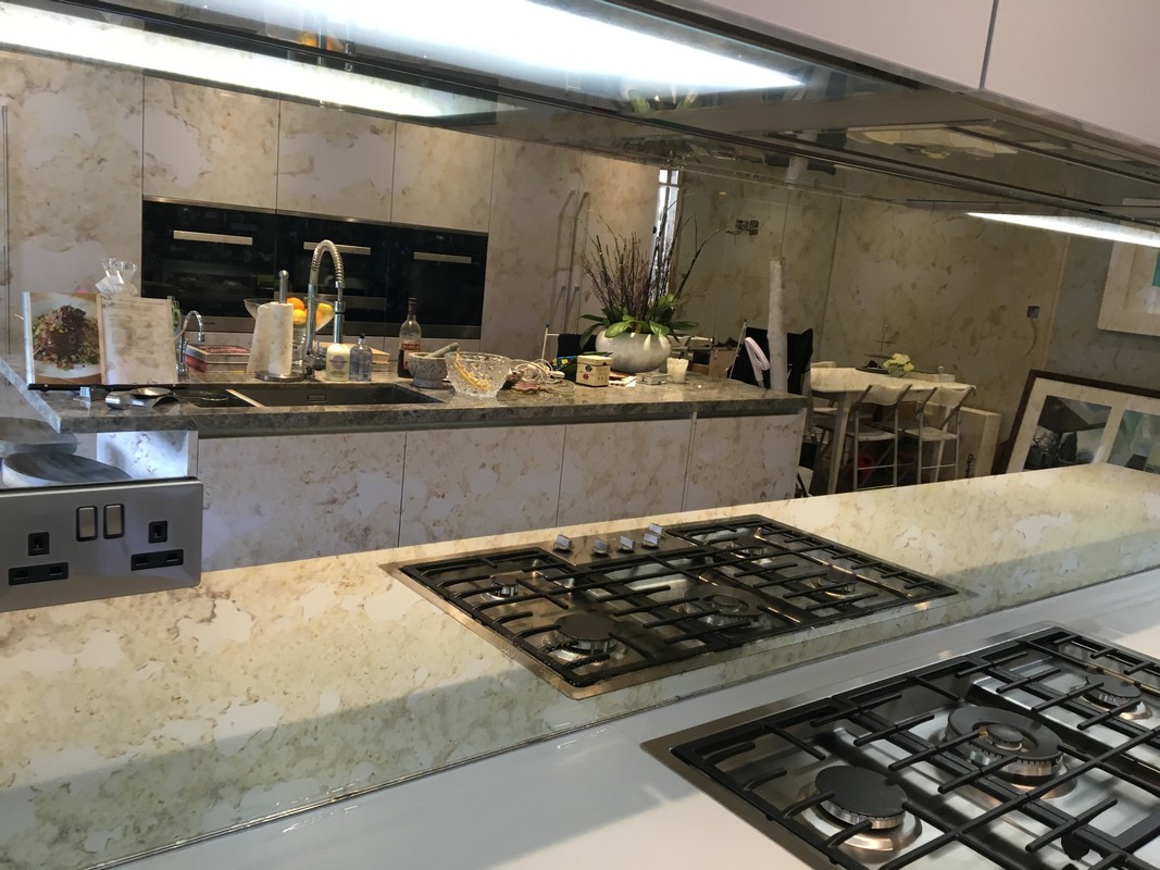 Mirror glass splashback in Bushey luxury kitchen