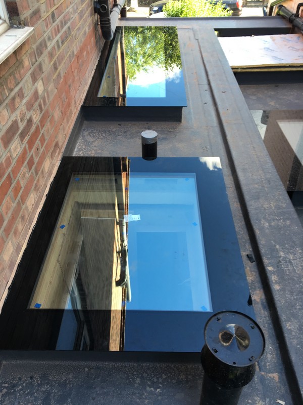 Multiple flat roof skylights on extension in Bushey