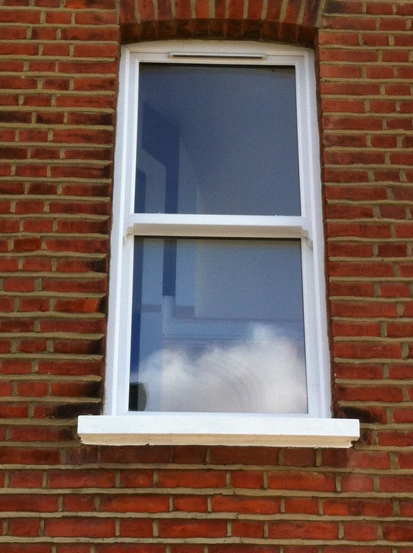 uPVC sash window on Victorian red brick house in Bushey